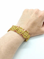 Load image into Gallery viewer, bracelet doré en dentelle de frivolité tatting perles rouges Pilar Navarro Paris
